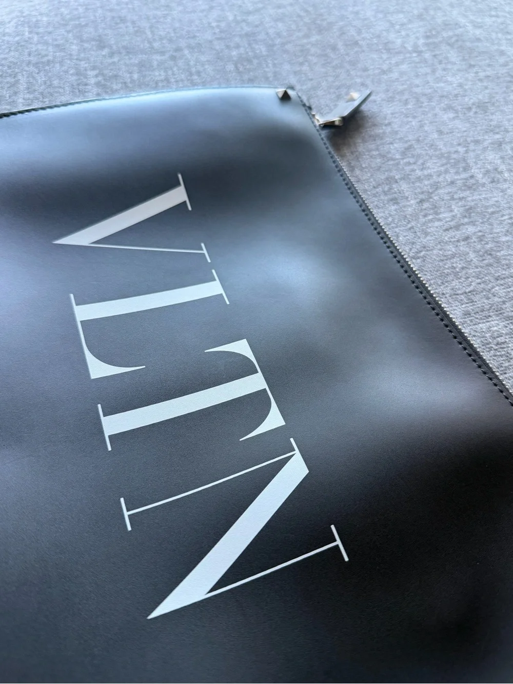 Valentino Garavani VLTN Black Leather Zip Pouch with Stud Accents